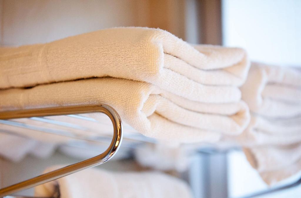 Postel nebo postele na pokoji v ubytování Hotel Universal
