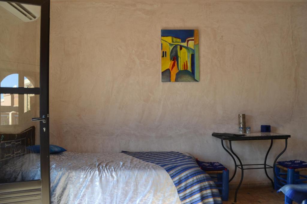 Postel nebo postele na pokoji v ubytování Riad Dar Bergui