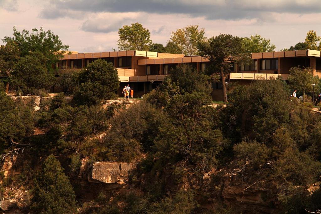 a building on top of a hill with trees at Kachina Lodge - Inside the Park in Grand Canyon Village