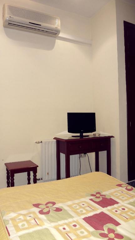 TV a/nebo společenská místnost v ubytování Hostal el Volao