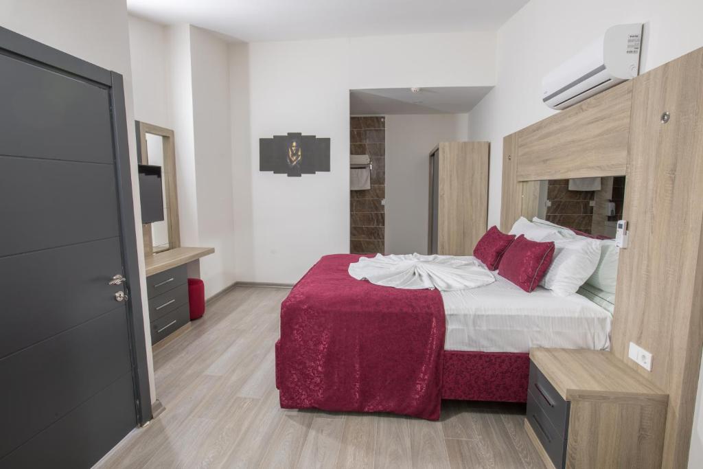 Postel nebo postele na pokoji v ubytování Elanis Suites