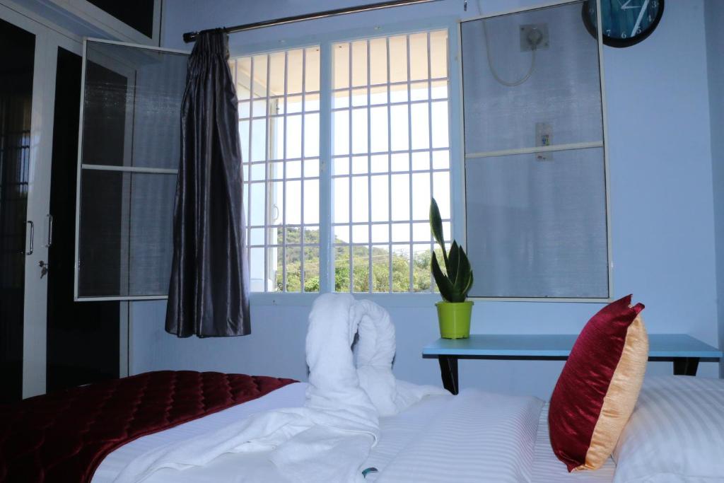 Postel nebo postele na pokoji v ubytování Hotel NKC Airport