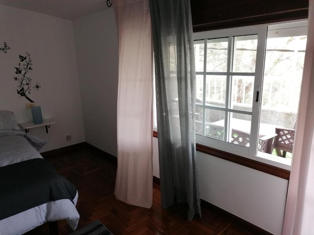 Postel nebo postele na pokoji v ubytování Casa Ribe