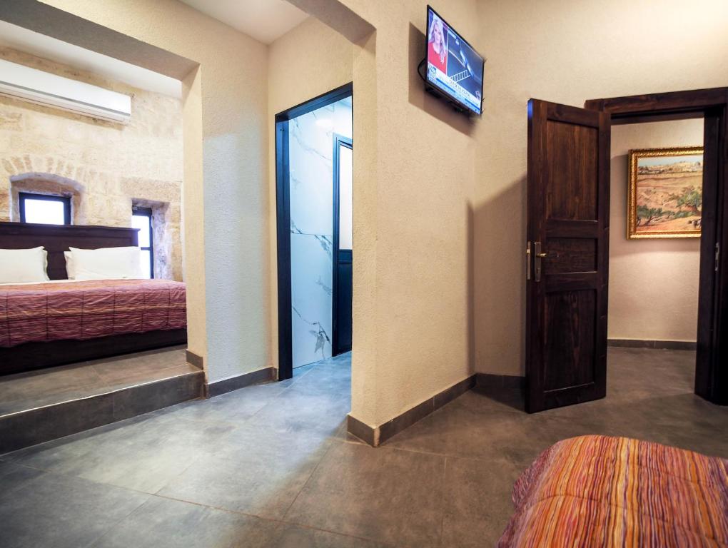 Postel nebo postele na pokoji v ubytování New Imperial Hotel