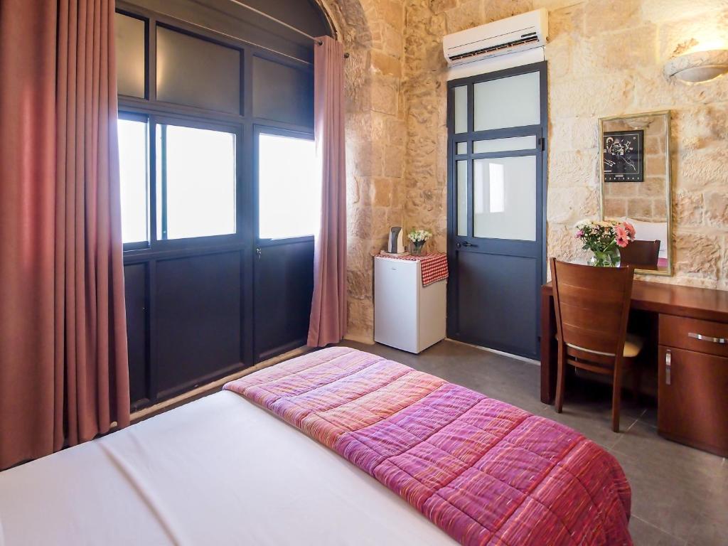 Postel nebo postele na pokoji v ubytování New Imperial Hotel
