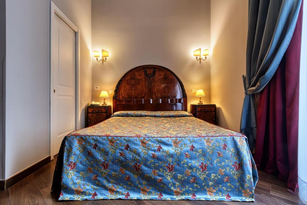 Postel nebo postele na pokoji v ubytování Decumani Hotel De Charme