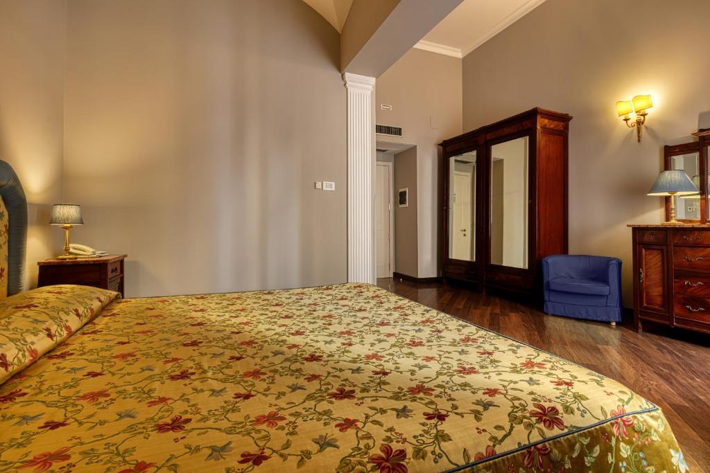 Postel nebo postele na pokoji v ubytování Decumani Hotel De Charme