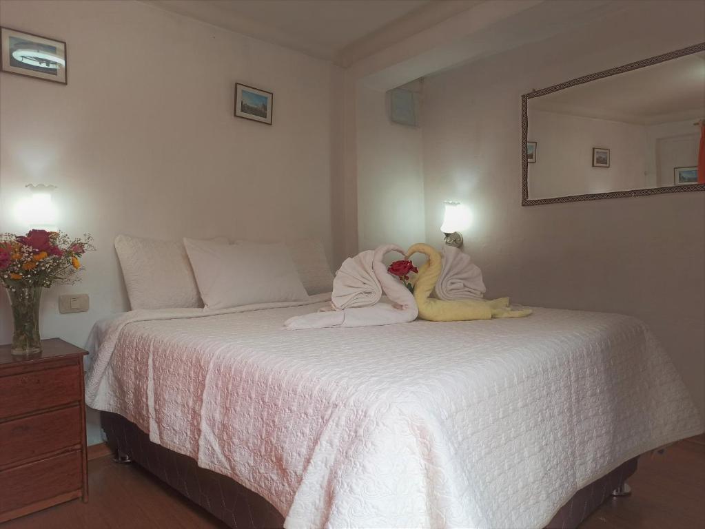 Letto o letti in una camera di Hostal Tu Hogar