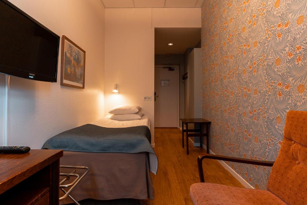 Postel nebo postele na pokoji v ubytování Hotel Lorensberg