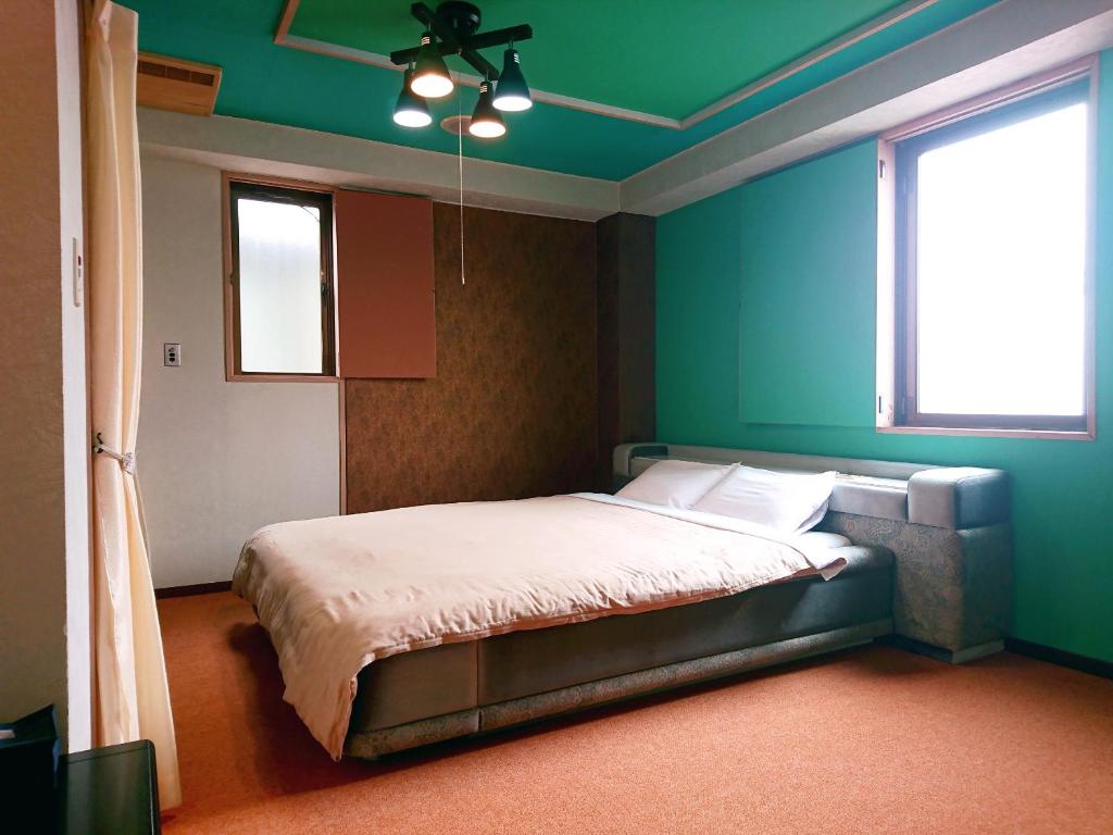 Postel nebo postele na pokoji v ubytování Hotel Unicorn