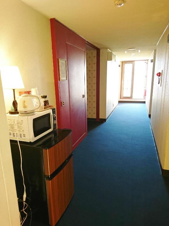 Kuchyň nebo kuchyňský kout v ubytování Hotel Unicorn