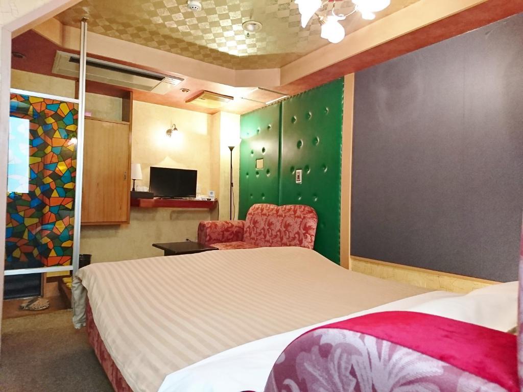 Postel nebo postele na pokoji v ubytování Hotel Unicorn