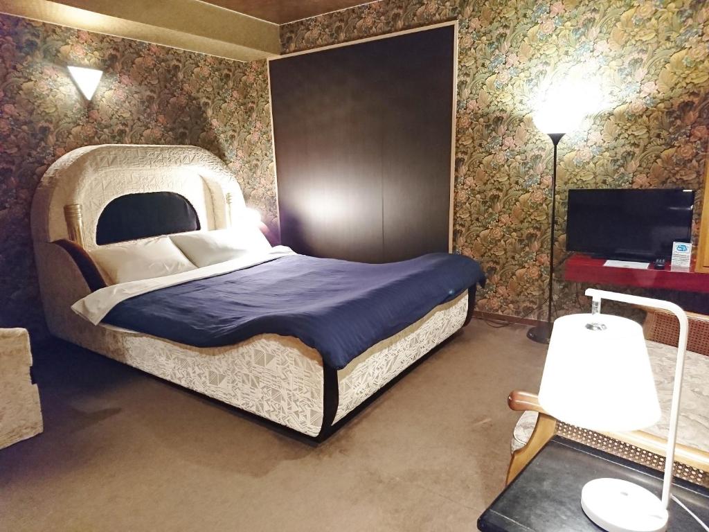 Postel nebo postele na pokoji v ubytování Hotel Unicorn