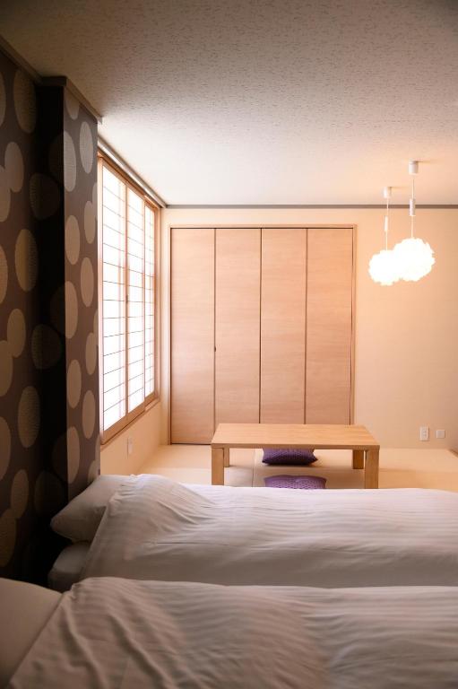 Postel nebo postele na pokoji v ubytování BEYOND HOTEL Takayama 3rd