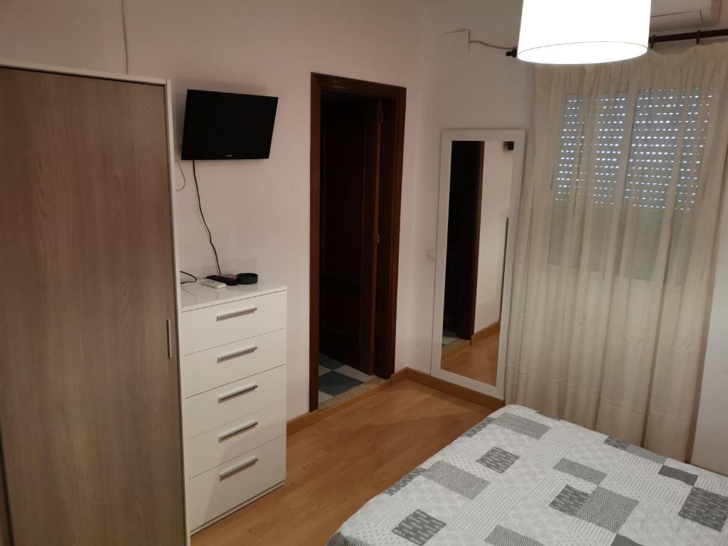 Posteľ alebo postele v izbe v ubytovaní Hotel Mesón El Número Uno