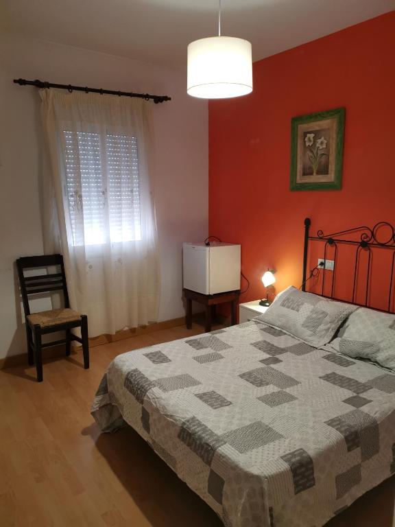 Posteľ alebo postele v izbe v ubytovaní Hotel Mesón El Número Uno