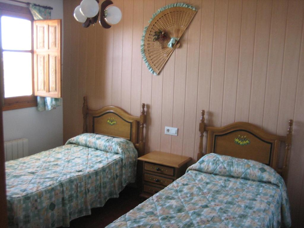 Postel nebo postele na pokoji v ubytování Alojamiento Rural Mirador del Avellano
