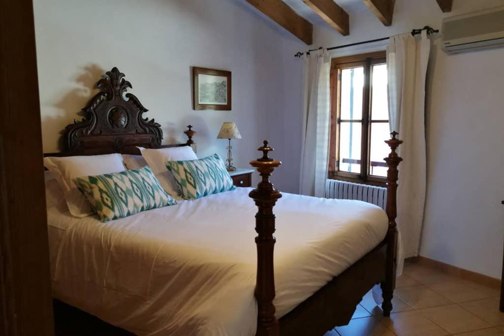a bedroom with a large bed in a room at Casa Es Mercat in Sóller