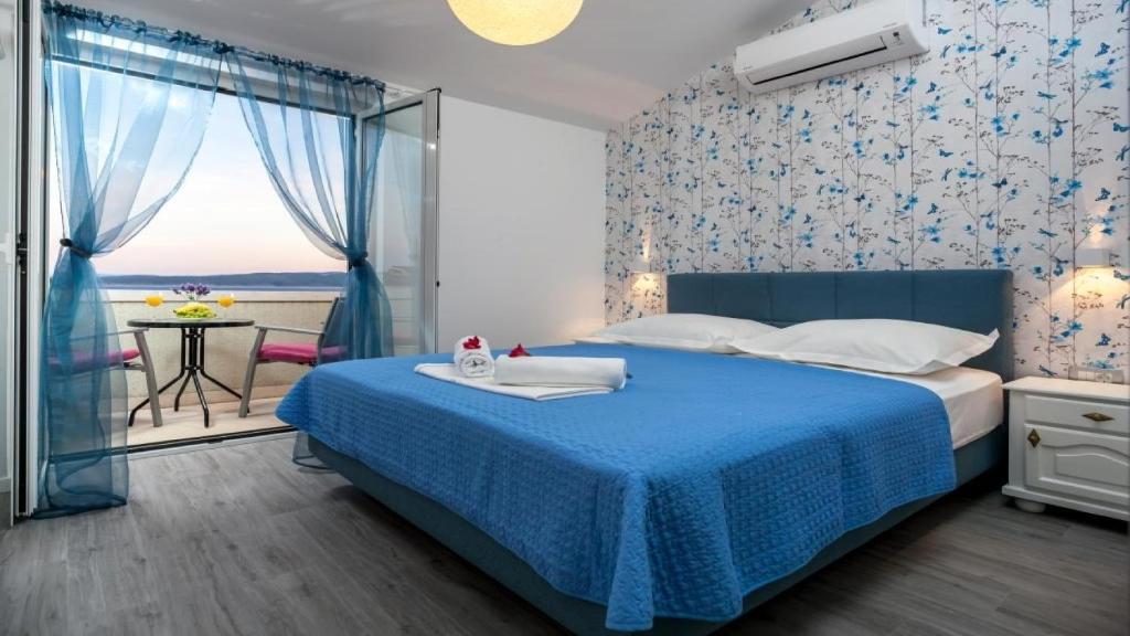 Postel nebo postele na pokoji v ubytování Apartments Angela