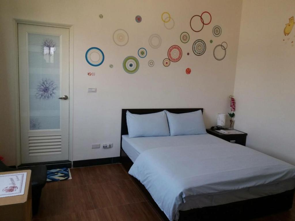 Postel nebo postele na pokoji v ubytování Jin Xi Fu B&B