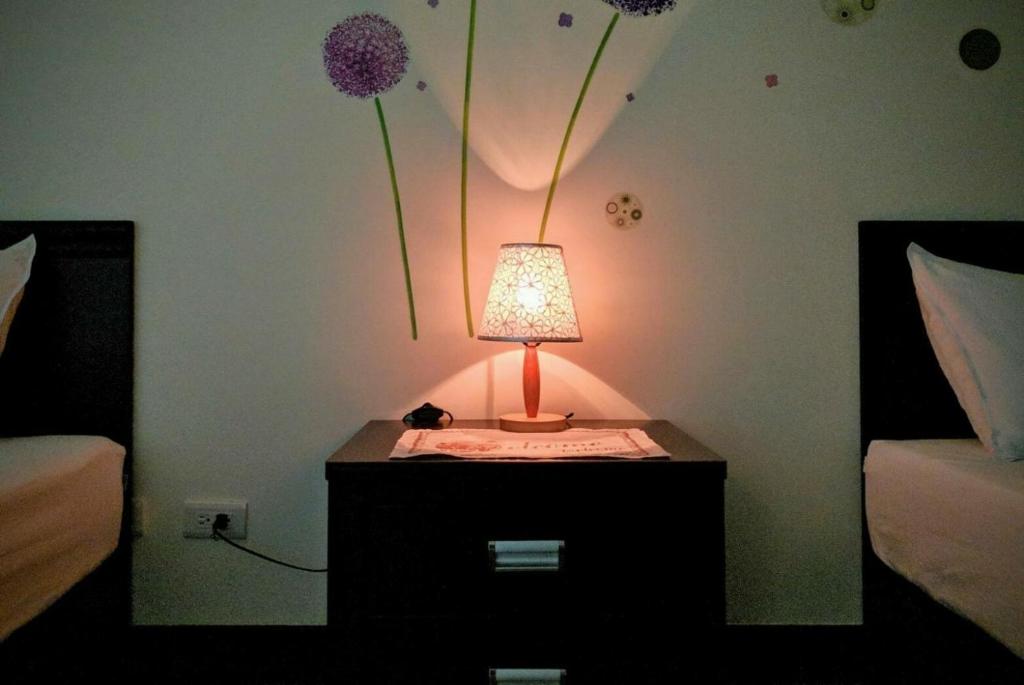 Postel nebo postele na pokoji v ubytování Jin Xi Fu B&B