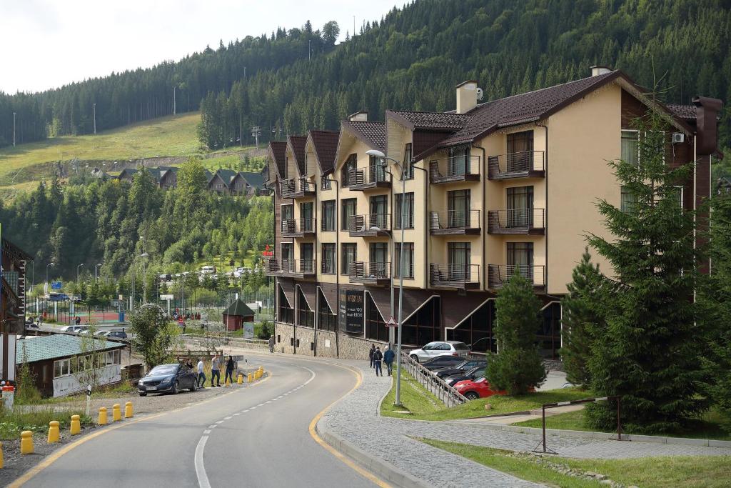 a large building on the side of a road at Bukovel Apart in Bukovel