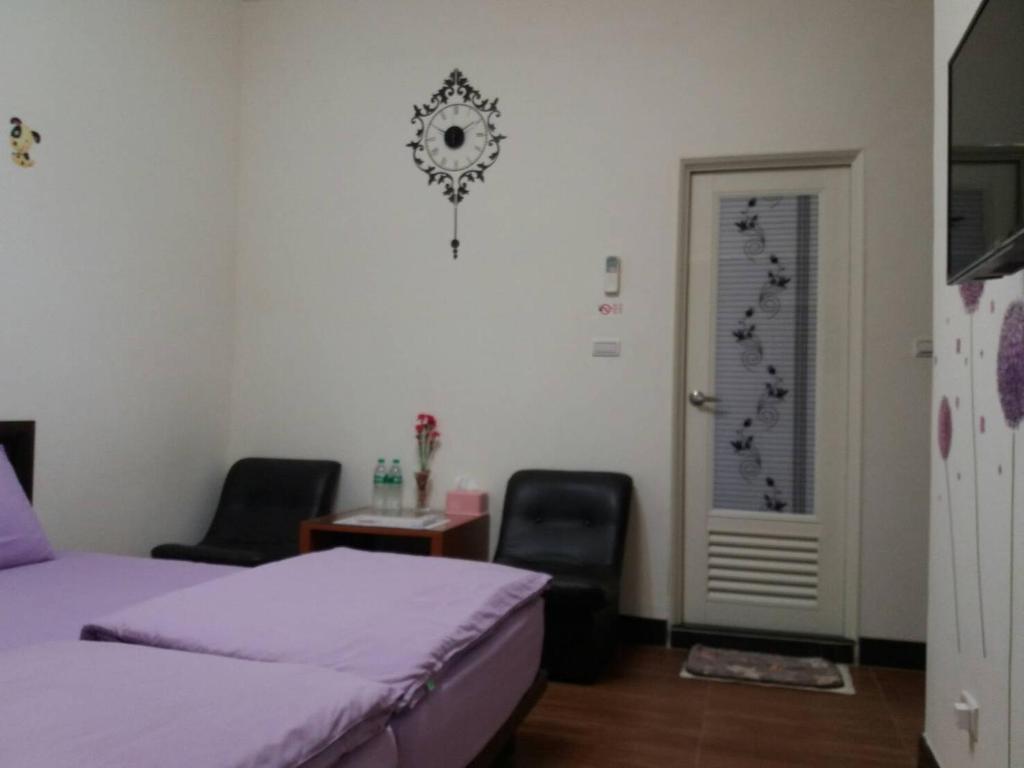 Postel nebo postele na pokoji v ubytování Jin Xi Fu B&B