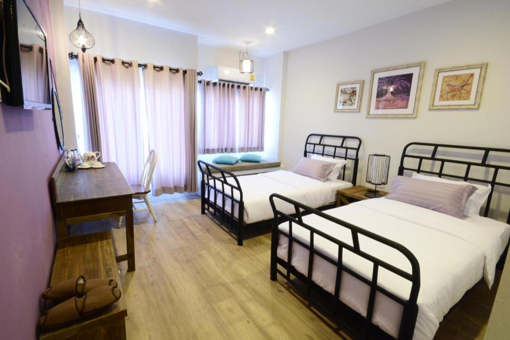 Postel nebo postele na pokoji v ubytování Hotel Toscana Trat