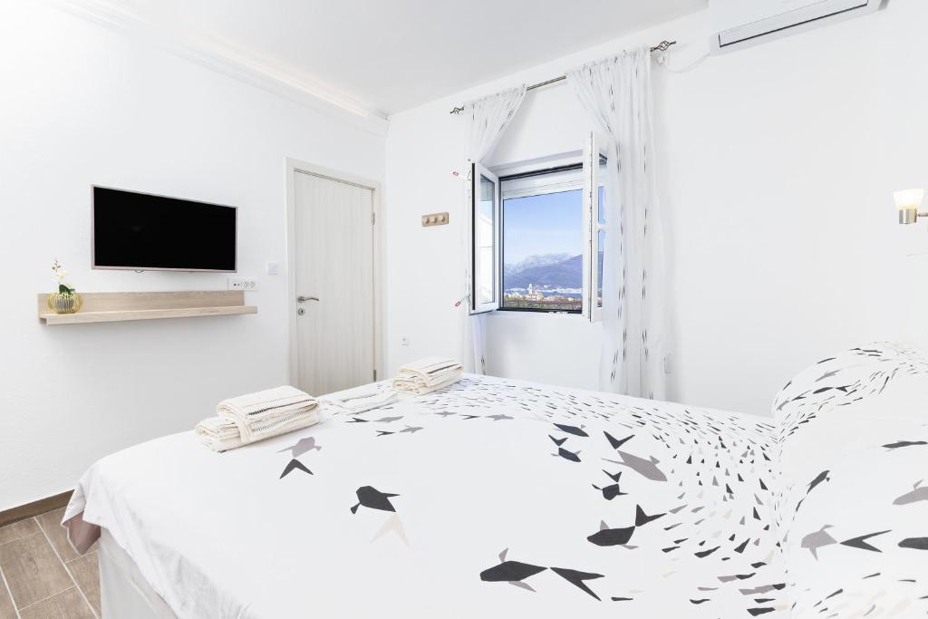 Voodi või voodid majutusasutuse Apartments Natasa toas