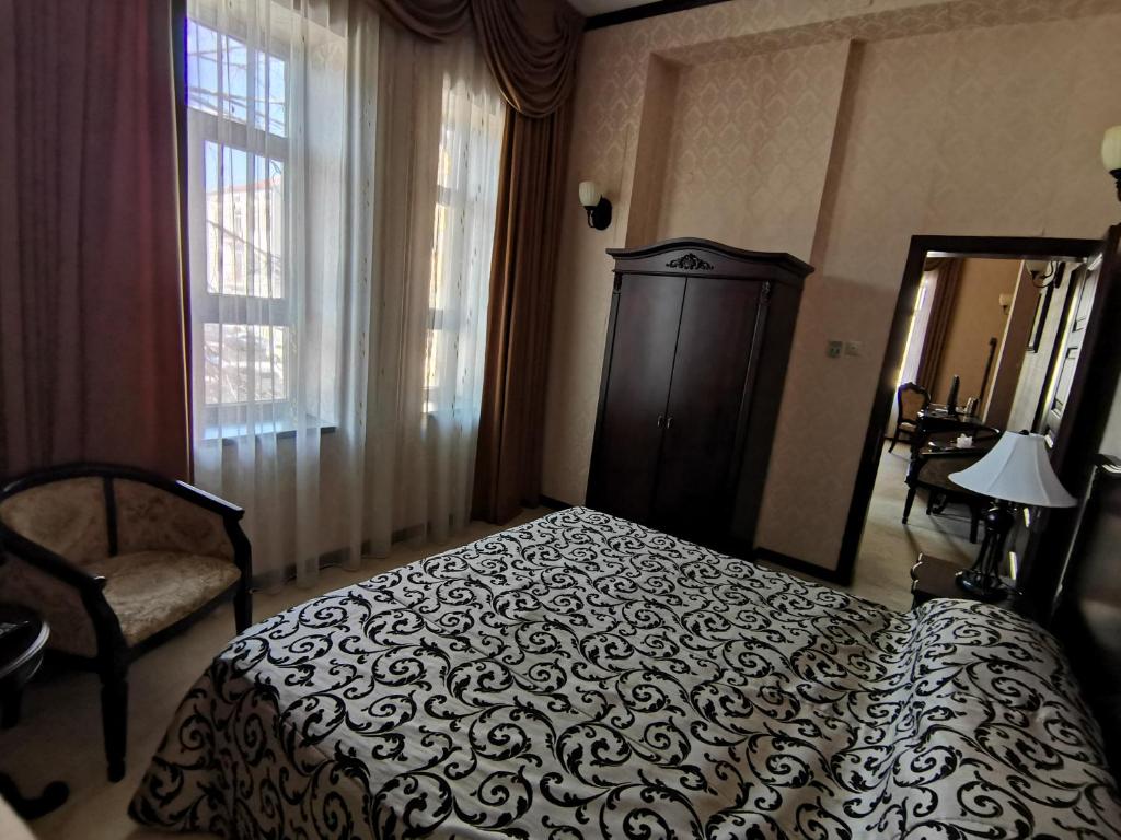 Кровать или кровати в номере Hotel Carol