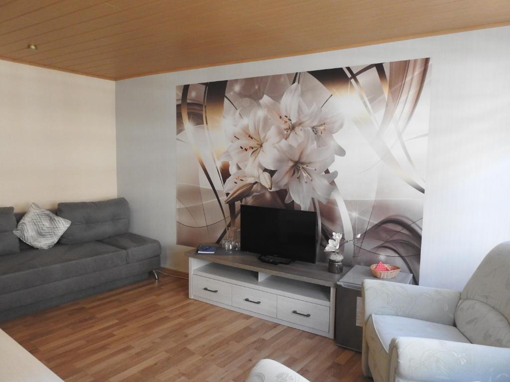 TV a/nebo společenská místnost v ubytování Ratsstübchen