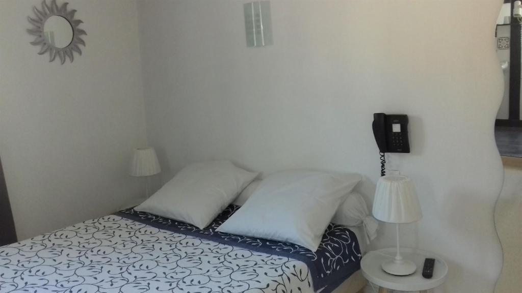 Postel nebo postele na pokoji v ubytování Le palais, hôtel - restaurant