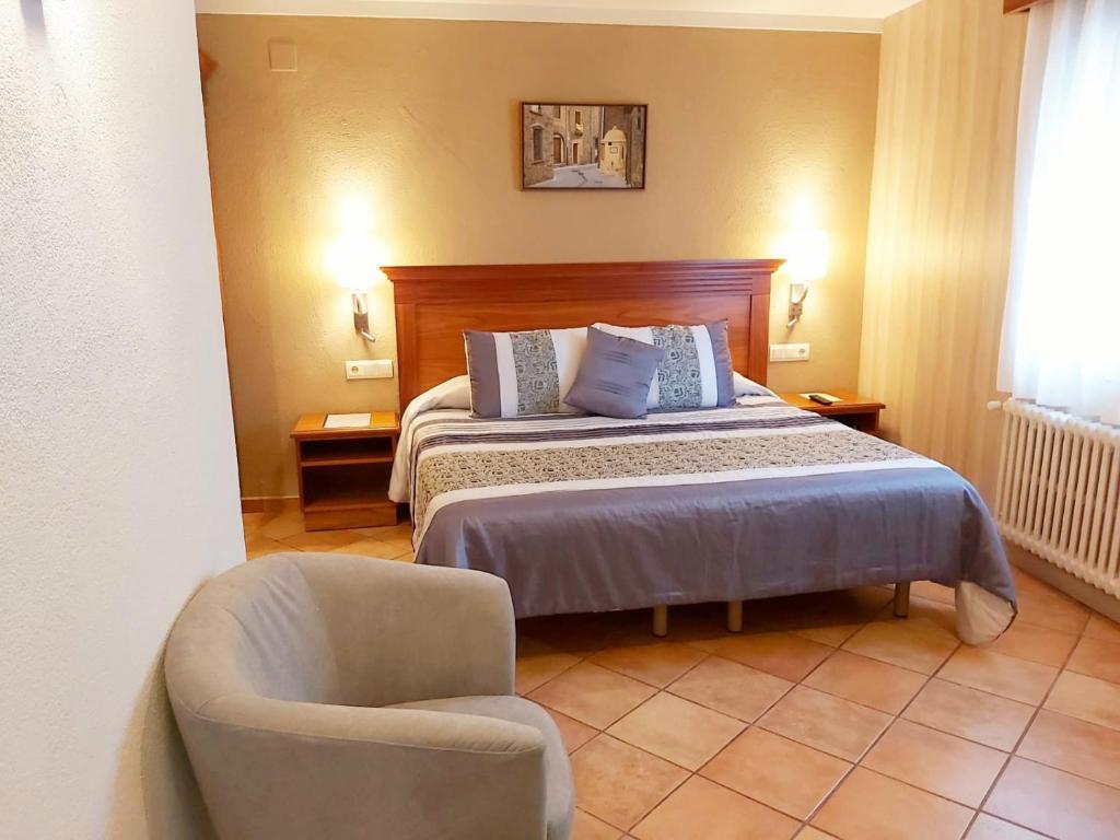 Postel nebo postele na pokoji v ubytování Hotel-Restaurante La Quadra
