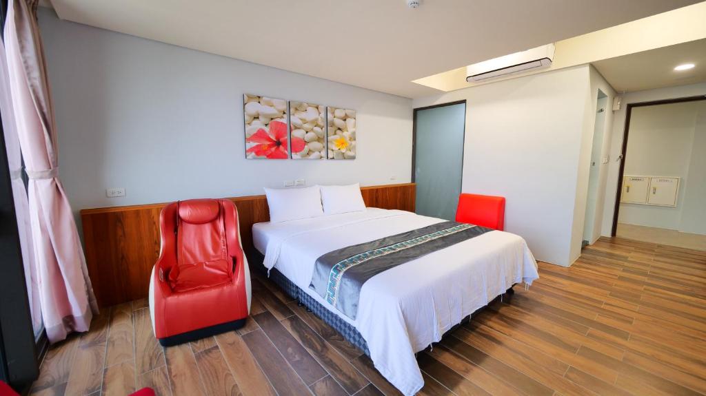 Postel nebo postele na pokoji v ubytování Apause Hotel