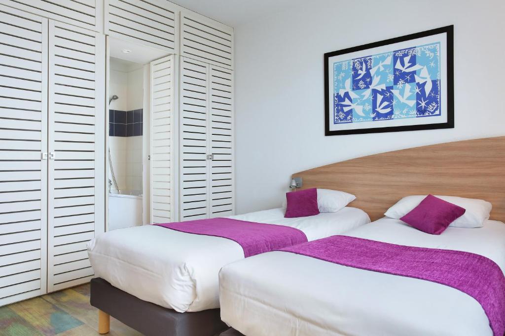 Postel nebo postele na pokoji v ubytování Suite-Home Orléans-Saran