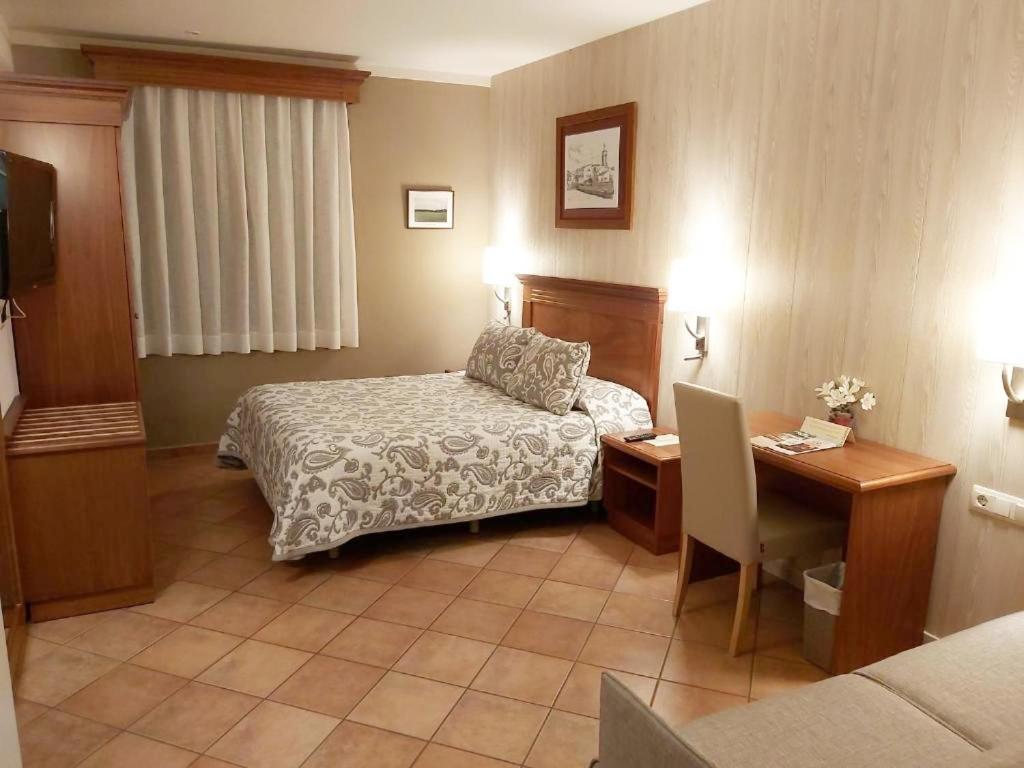 Postel nebo postele na pokoji v ubytování Hotel-Restaurante La Quadra