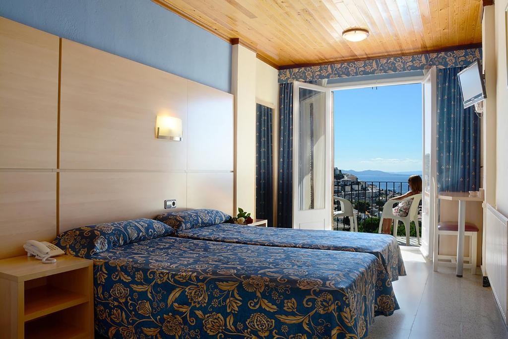 Postel nebo postele na pokoji v ubytování Hotel Grecs