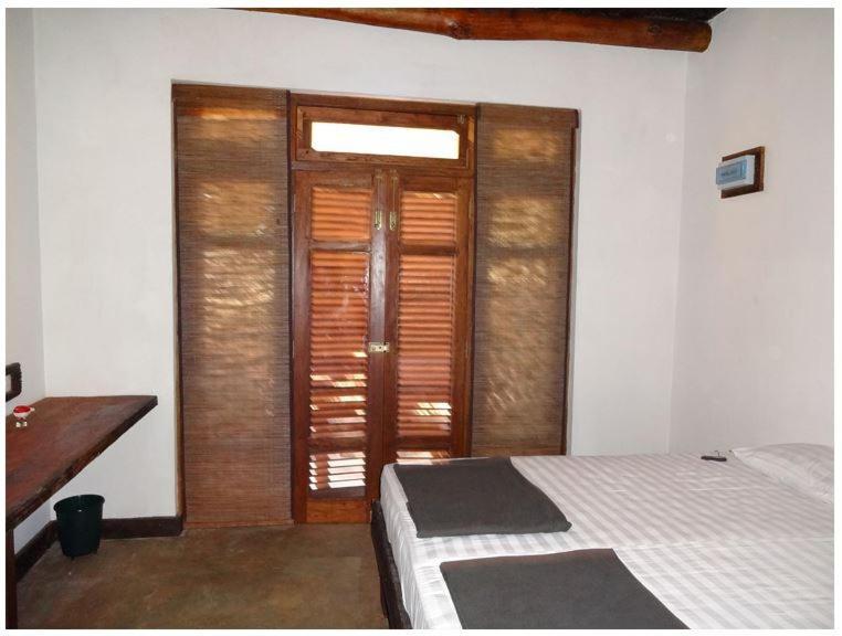 Postel nebo postele na pokoji v ubytování Ella Okreech Cottages