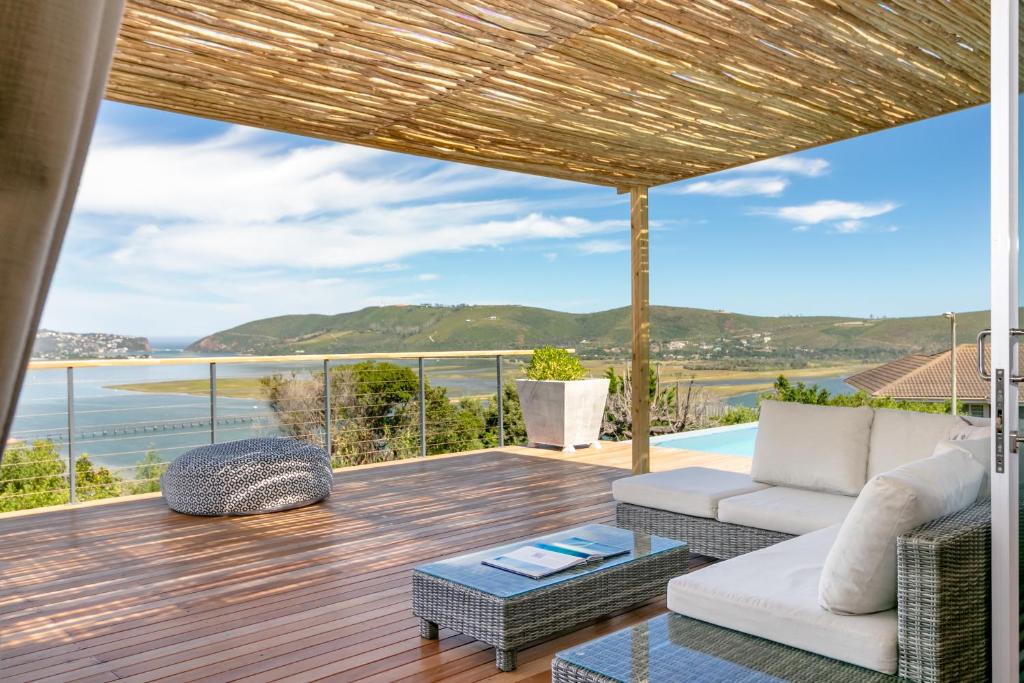 a living room with a view of the ocean at Paradise on Ridge in Knysna
