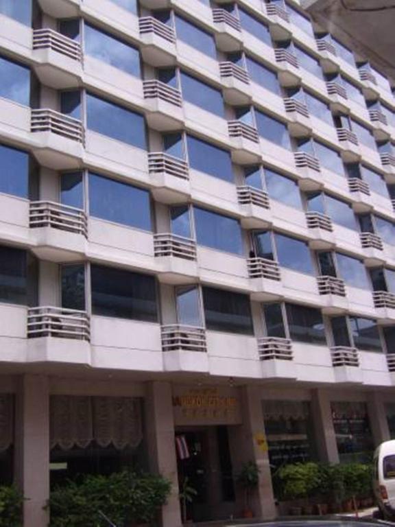 a large building with balconies on the side of it at Bangkok City Inn in Bangkok
