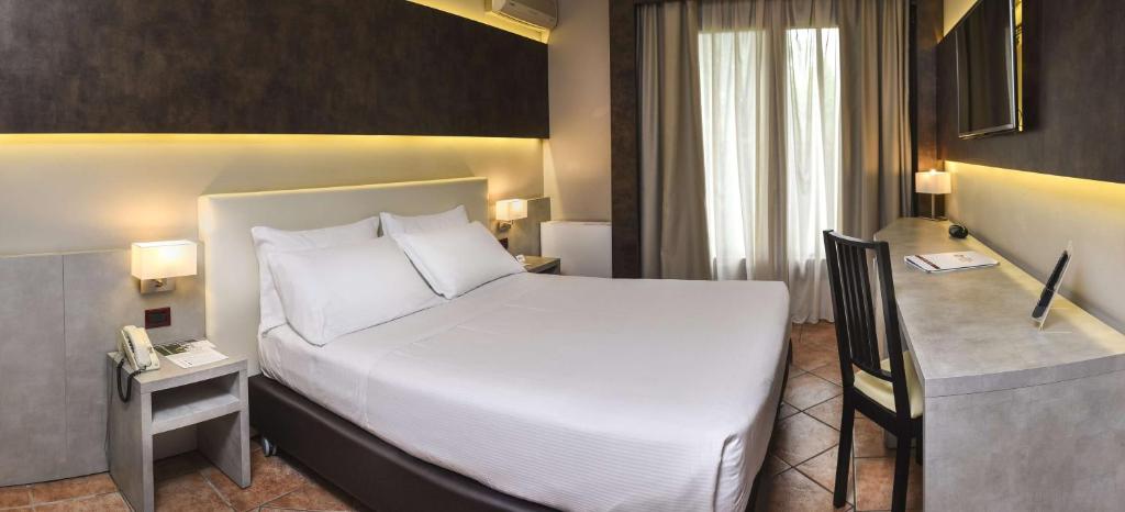 Łóżko lub łóżka w pokoju w obiekcie Best Western Plus Hotel Modena Resort