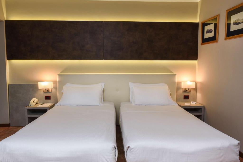 Łóżko lub łóżka w pokoju w obiekcie Best Western Plus Hotel Modena Resort