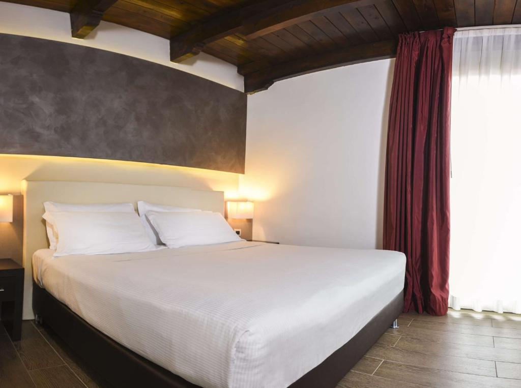 Łóżko lub łóżka w pokoju w obiekcie Best Western Plus Hotel Modena Resort