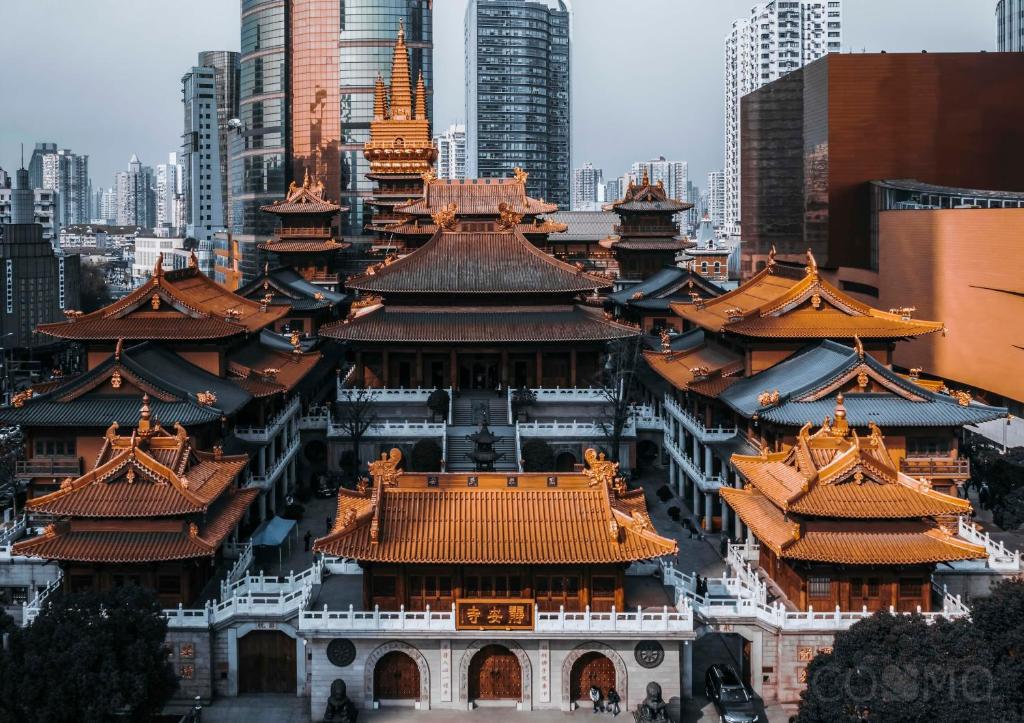 a large building with orange roofs in a city at Shanghai Cosmo World Union Service Apartment in Shanghai