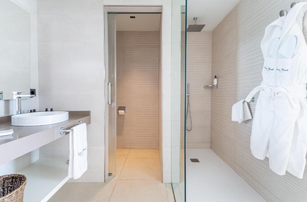 a bathroom with a shower and a sink at Hotel Lava Beach in Puerto del Carmen