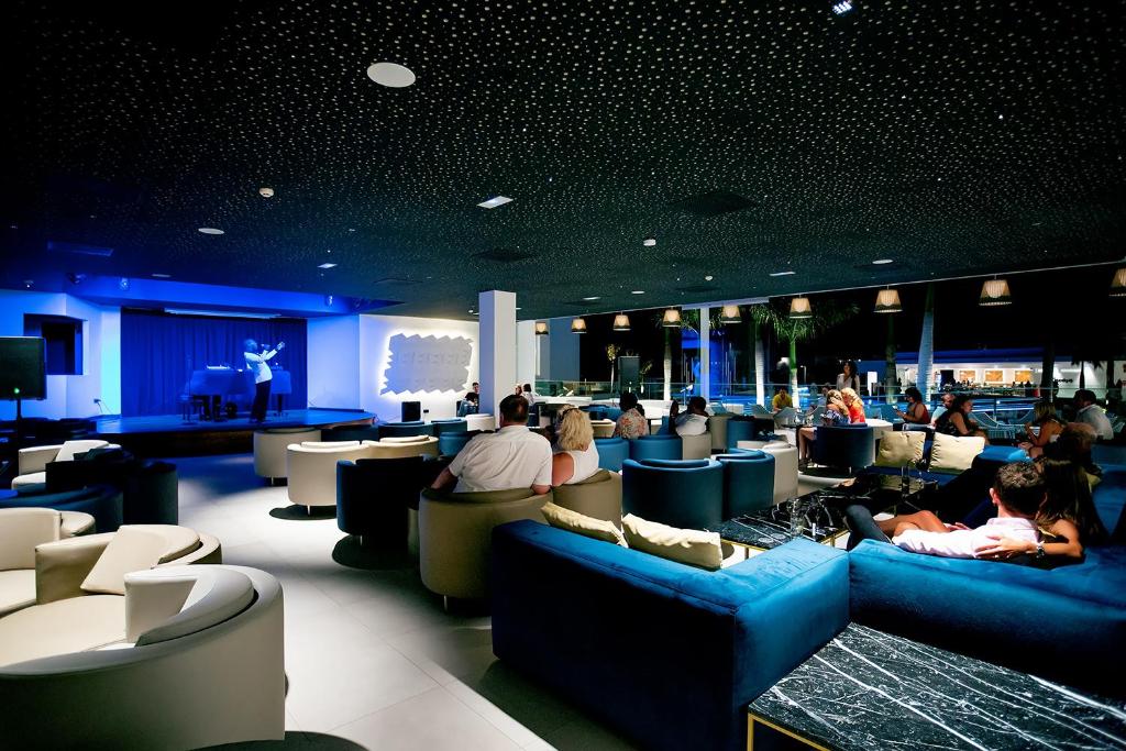 a group of people sitting in a waiting room at Hotel Lava Beach in Puerto del Carmen
