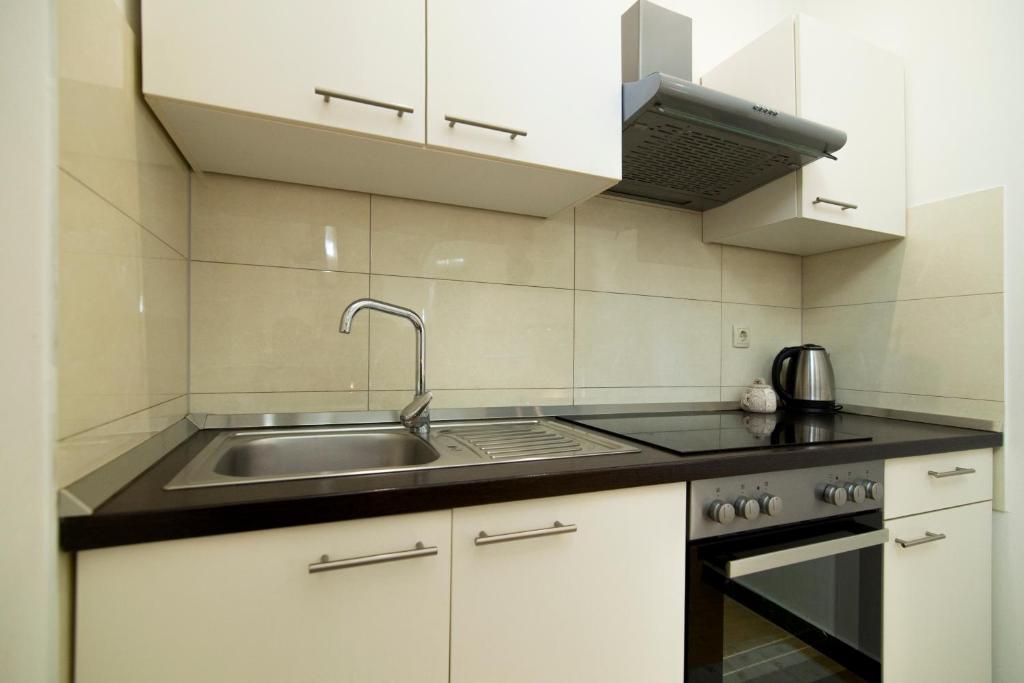 Kuchyňa alebo kuchynka v ubytovaní Apartment SunDelight