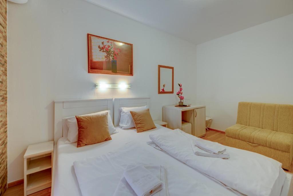 Postel nebo postele na pokoji v ubytování Hotel Galia