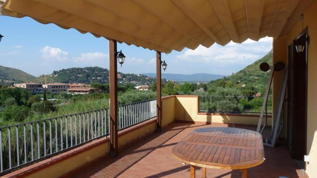 a balcony with a table and a view at Mare e Monti in Porto Ercole