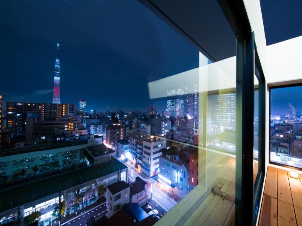a view of a city at night from a building at Super Hotel Tokyo Kinshicho Ekimae / Vacation STAY 79355 in Tokyo
